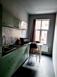 Kuchyň nebo kuchyňský kout v ubytování HDC Nivelles Grand-Place