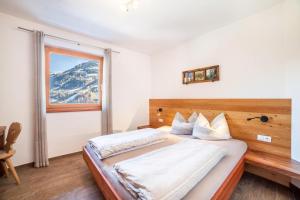 Postel nebo postele na pokoji v ubytování Chalet Ebnerhof