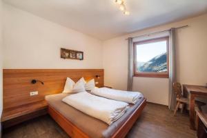 Postel nebo postele na pokoji v ubytování Chalet Ebnerhof