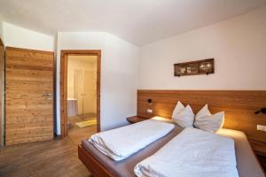Postel nebo postele na pokoji v ubytování Chalet Ebnerhof