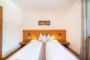 Postel nebo postele na pokoji v ubytování Chalet Ebnerhof