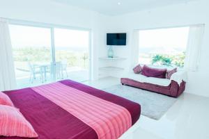 Ein Bett oder Betten in einem Zimmer der Unterkunft Rapture Surfcamps Green Bowl