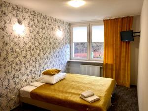 Postel nebo postele na pokoji v ubytování Sosnowe Zacisze + 37 fotografií