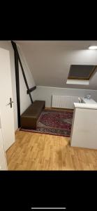 a room with a staircase with a bed and a rug at Barcelona . CHILLINGHOUSE # 10, 3 Min. von ICE, NETFLIX, Garten in Siegburg