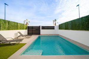 a swimming pool in the backyard of a house at Villa Camilla in Roda