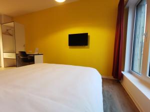 En eller flere senge i et værelse på Ooostel2be Brussel