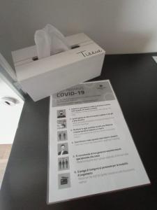 a box with a piece of paper on a table at La Tana del Ghiro Locazione Turistica in Sedico