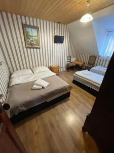 Łóżko lub łóżka w pokoju w obiekcie Agropajda