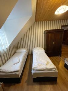 Łóżko lub łóżka w pokoju w obiekcie Agropajda