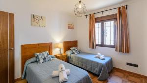 Posteľ alebo postele v izbe v ubytovaní Casa Olivia Cómpeta by Ruralidays