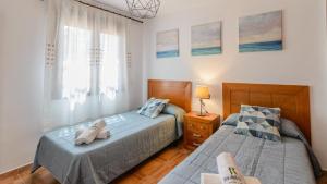 Posteľ alebo postele v izbe v ubytovaní Casa Olivia Cómpeta by Ruralidays