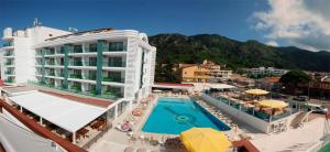 a hotel with a swimming pool and a resort at Idas Hotel in Marmaris