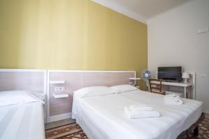 Postel nebo postele na pokoji v ubytování Albergo Centrale