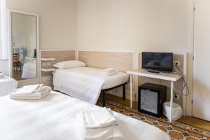 Postel nebo postele na pokoji v ubytování Albergo Centrale