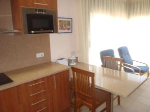 Kuchyň nebo kuchyňský kout v ubytování Apartment estudi + 7 fotografií