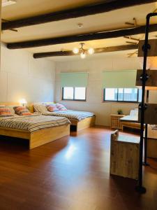 Postel nebo postele na pokoji v ubytování Sinnan12 Homestay桃園市民宿059號