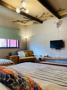 TV a/nebo společenská místnost v ubytování Sinnan12 Homestay桃園市民宿059號 + 37 fotografií