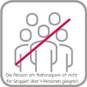 a sign with a group of people with a red line at Pension Am Nationalpark in Stadt Wehlen