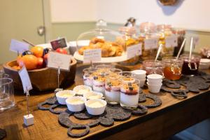 a buffet with desserts and other food on a table at Brooks Guesthouse Bristol in Bristol +9 photos