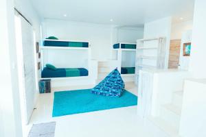 Ein Bett oder Betten in einem Zimmer der Unterkunft Rapture Surfcamps Green Bowl