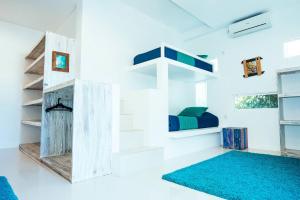 Ein Bett oder Betten in einem Zimmer der Unterkunft Rapture Surfcamps Green Bowl