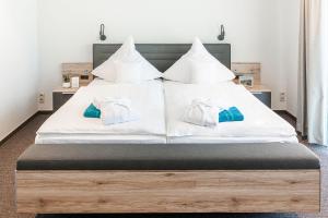 Postel nebo postele na pokoji v ubytování Hotel Die Post Meerfeld
