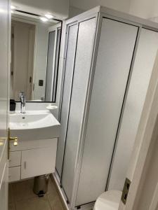 a bathroom with a toilet and a sink at Departamento Pucón in Pucón