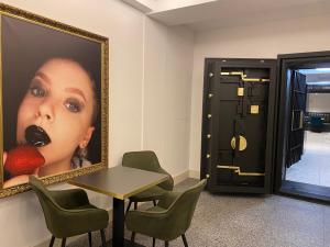 a meeting room with a table and a picture of a woman at The Gold Bank in Prague