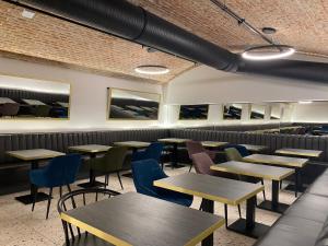 a row of tables and chairs in a restaurant at The Gold Bank in Prague