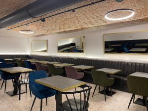a row of tables and chairs in a restaurant at The Gold Bank in Prague