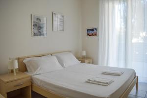 Säng eller sängar i ett rum på Homiday - Appartamenti I Gabbiani