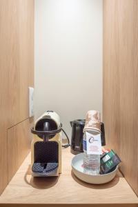 a coffee maker sitting on top of a counter at The Originals Access Hôtel Bordeaux Aéroport in Mérignac