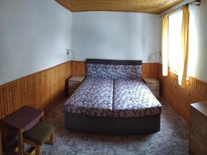 Postel nebo postele na pokoji v ubytování Chata-R Mariánská