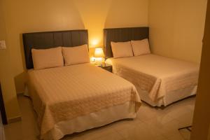 Orquidea Limon Hotel Boutique房間的床