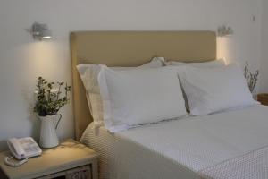 Voodi või voodid majutusasutuse Zefiros Traditional Hotel toas