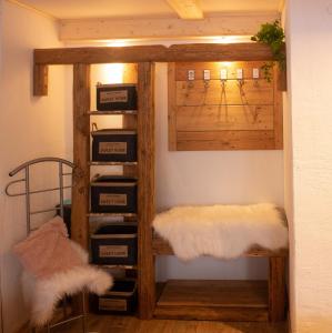 a room with a shelf with boxes in it at Fichtelgebirgshaus in Fichtelberg