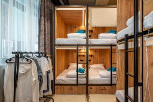 a hostel room with bunk beds and a window at HiLoft Hostel in Sochi