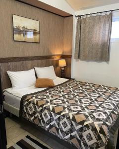 Кровать или кровати в номере Berloga-дом с сауной