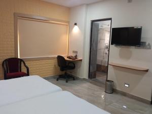 TV a/nebo společenská místnost v ubytování Soukyam Hotel