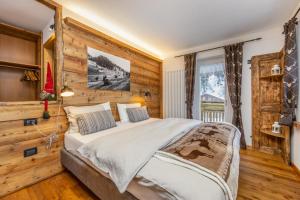 מיטה או מיטות בחדר ב-Rifugio Cereda