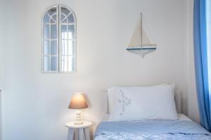 Posteľ alebo postele v izbe v ubytovaní SUN NEST HOUSE