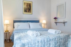 Posteľ alebo postele v izbe v ubytovaní SUN NEST HOUSE