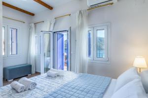 Posteľ alebo postele v izbe v ubytovaní SUN NEST HOUSE