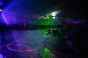 a close up of a stage with lasers at Exclusive High End Candlewood Lake retreat in New Fairfield