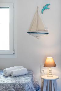 Posteľ alebo postele v izbe v ubytovaní SUN NEST HOUSE