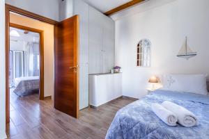Posteľ alebo postele v izbe v ubytovaní SUN NEST HOUSE