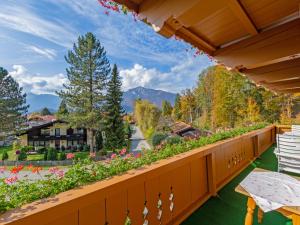 a balcony with a view of the mountains at Landhotel Gabriele in Unterwössen