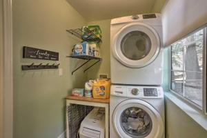 a laundry room with a washing machine and a washer at Cozy Cabin about 3 Mi to Lake Arrowhead Village! in Lake Arrowhead