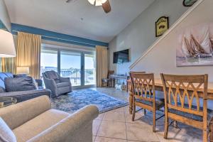 a living room with a couch and a table and chairs at Family Friendly Condo with Beach and Pool Access! in Destin