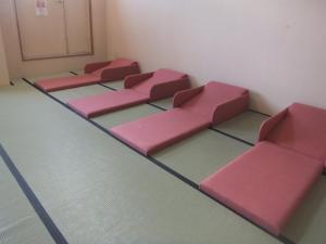 Un lugar para sentarse en Natural Onsen Hostel Hidamari no Yu